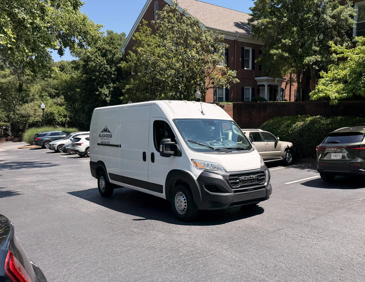 Blackridge Restoration service van in a North Atlanta neighborhood
